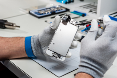 Close-up photos showing process of mobile phone repair