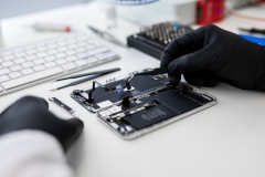 Close-up photo showing process of mobile phone repair in professional service